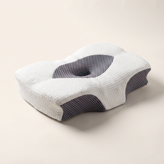 ELT CloudForm ergonomic cervical pillow — white quilted memory foam with charcoal honeycomb mesh side panels, studio product shot